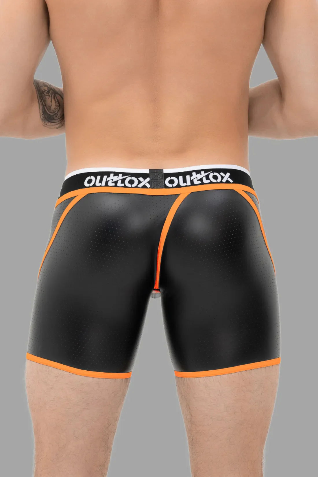 Outtox. Kurze Strumpfhose mit Wickel-Rücken. Schamkapsel mit Druckknopf. Schwarz und Orange