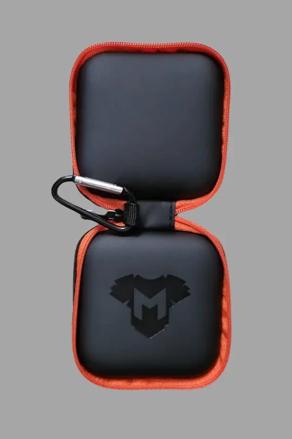 Maskulo Jax Wanderlust black and orange mini zip case with carabiner, durable EVA/PU accessory for cock rings.
